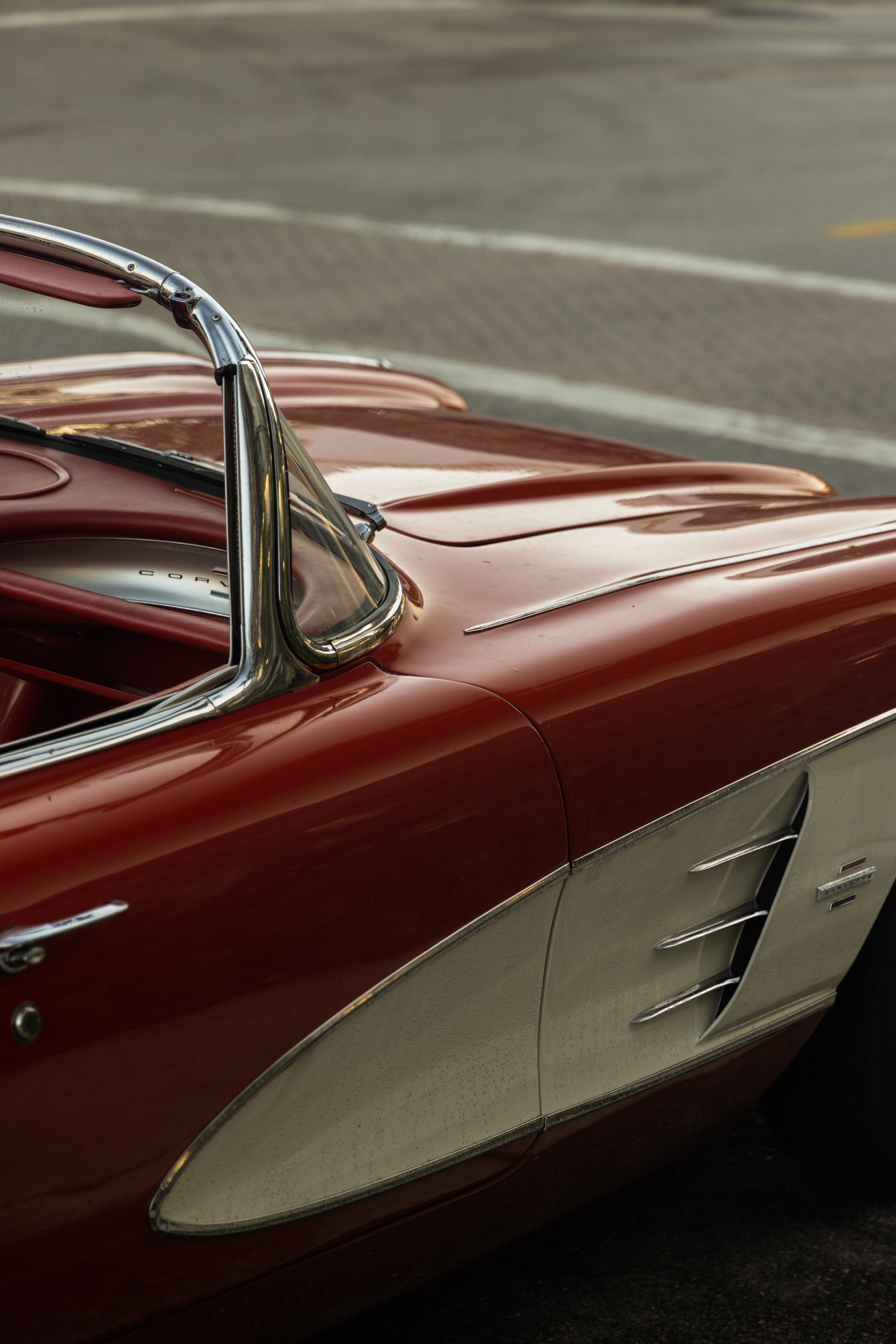 Classic car beside a Downtown Naples sidewalk