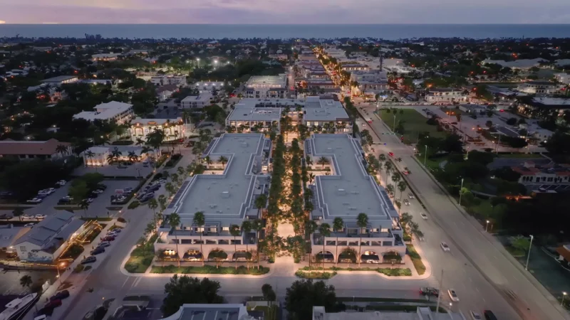 Ground-level shops and residences at dusk