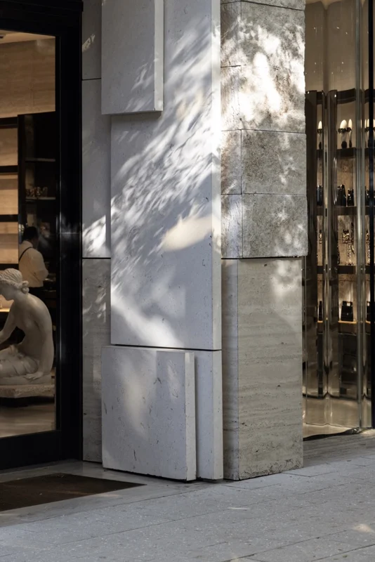 Shopfront window and stone facade